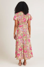 Model Ziara wearing size S of the Bloss Silk Blend Wrap Dress in colour Bloss (Pink), from the back