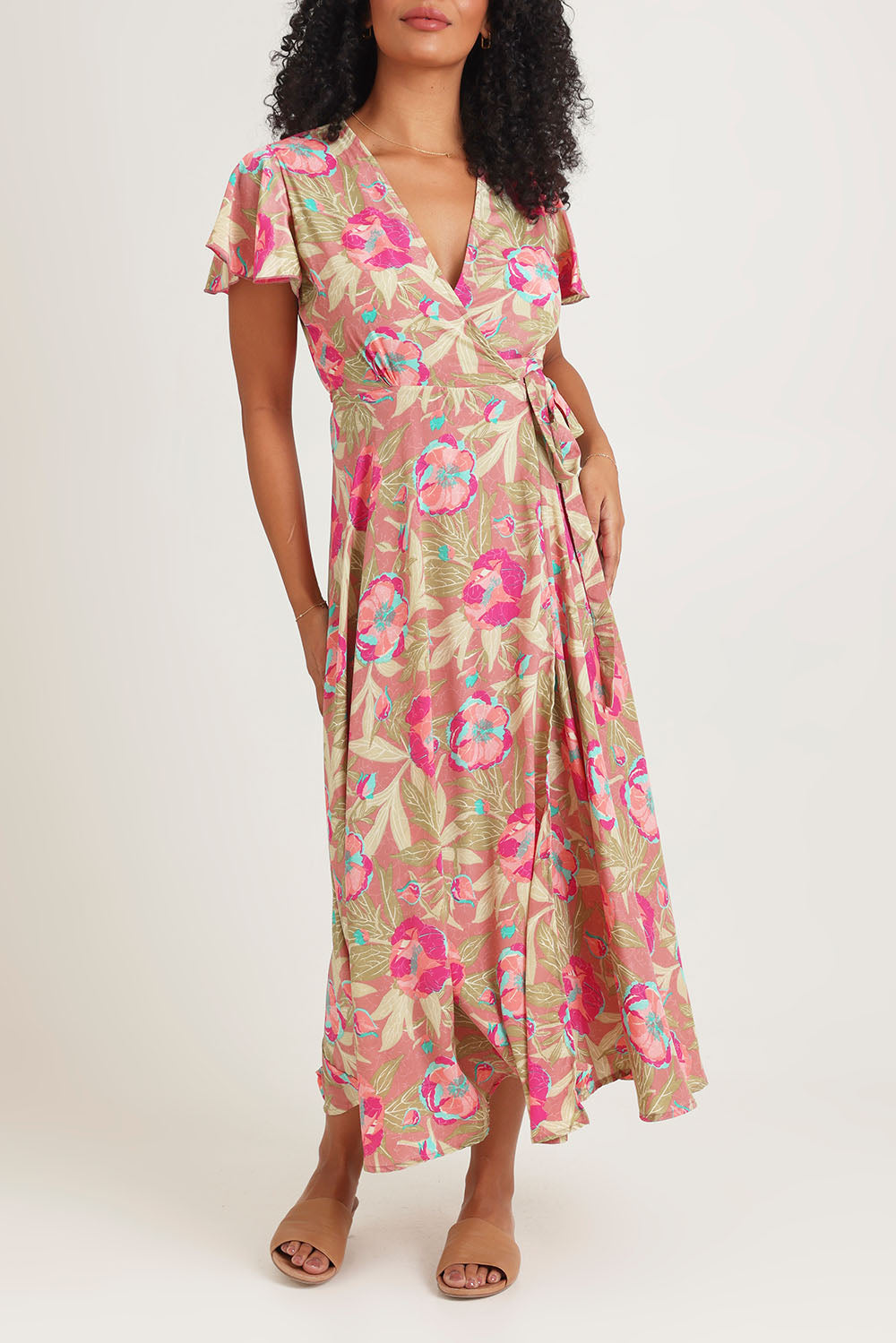 Model Ziara wearing size S of the Bloss Silk Blend Wrap Dress in colour Bloss (Pink), from the front, cropped image