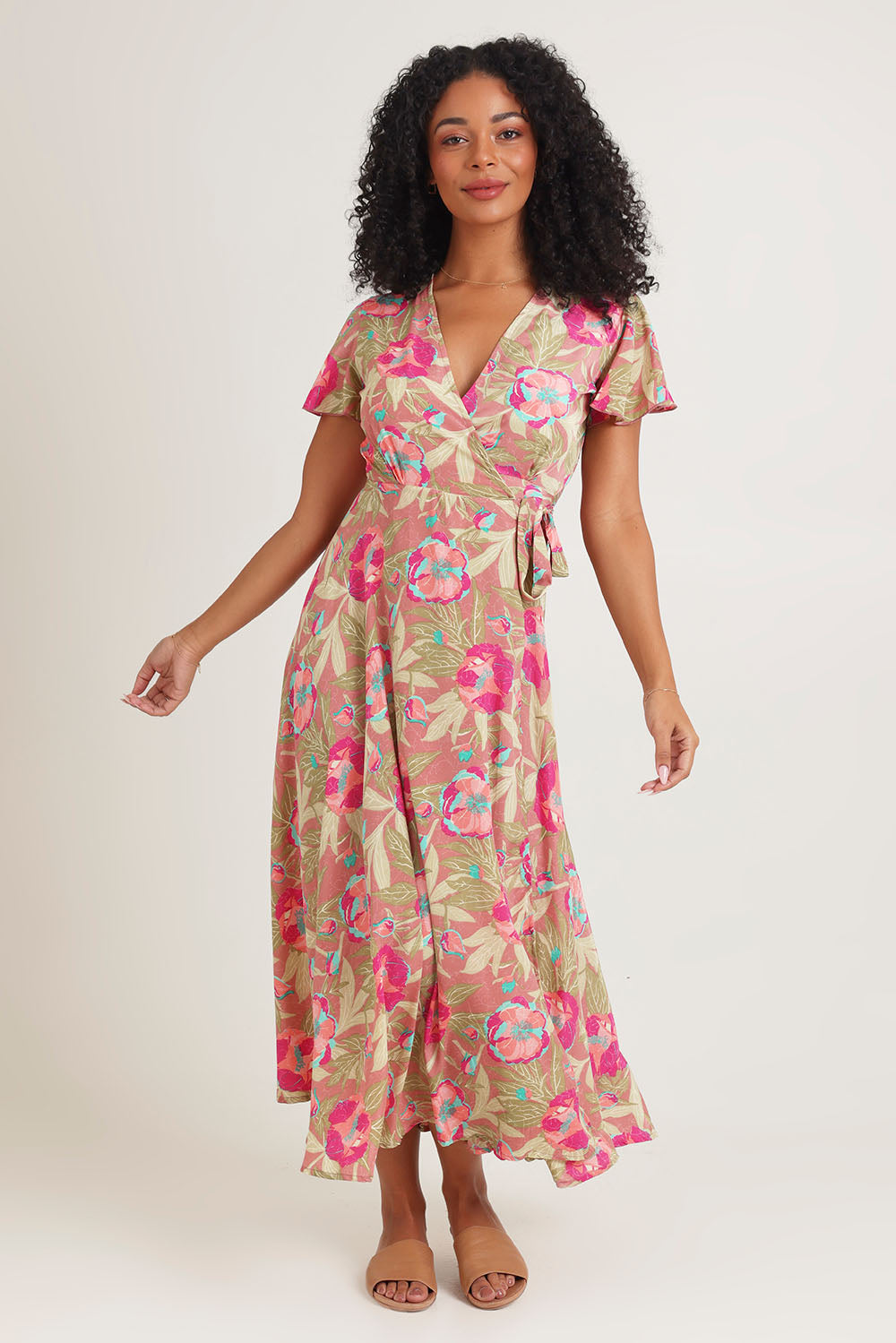 Model Ziara wearing size S of the Bloss Silk Blend Wrap Dress in colour Bloss (Pink), from the front, showing the whole outfit