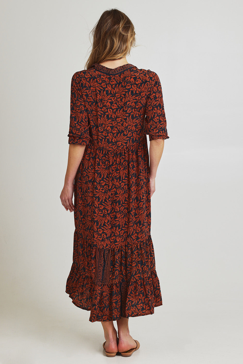 Model Olivia wearing size S of the Bodhi L/S Maxi Dress in colour Print (Blue), from the back