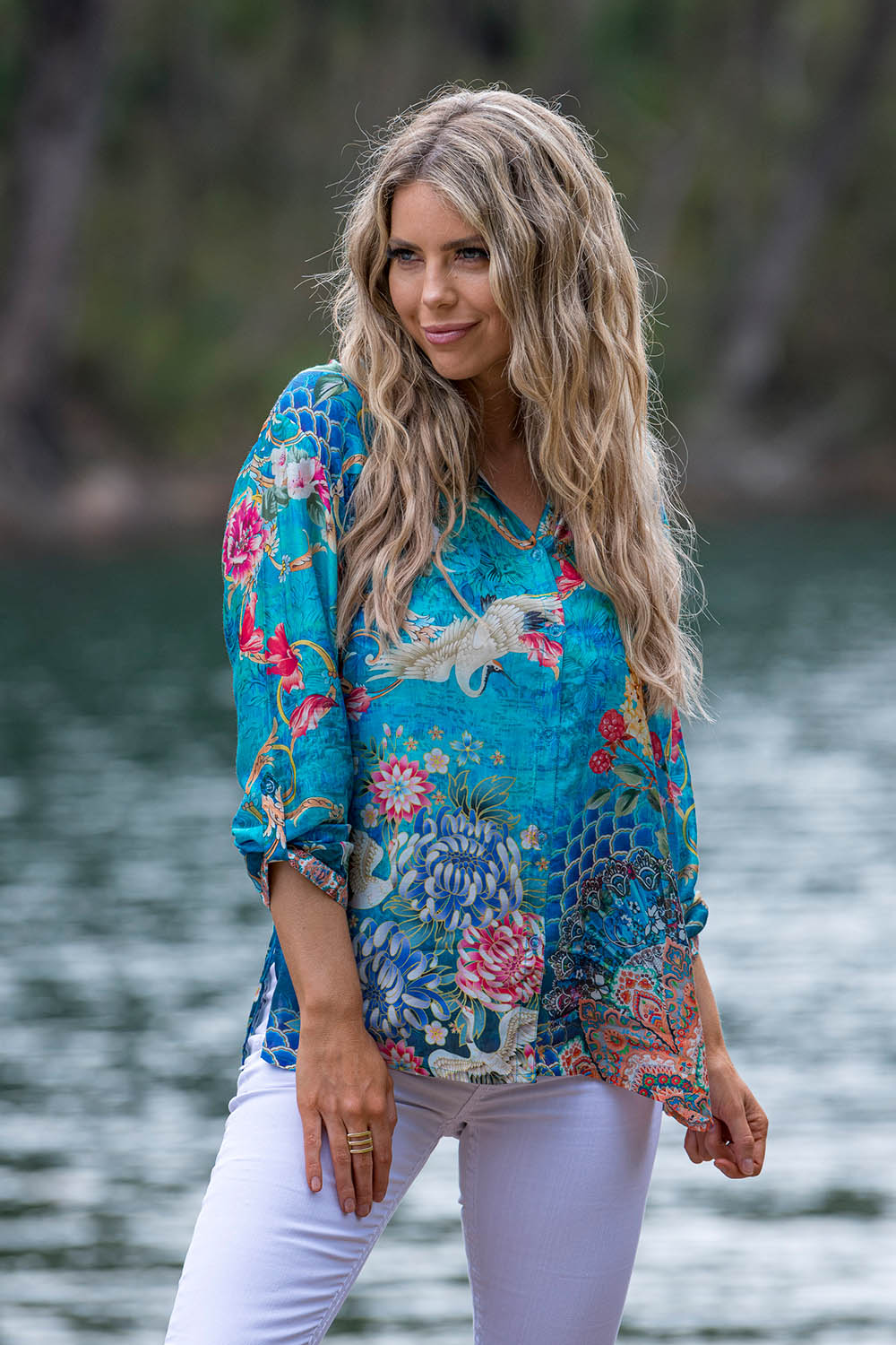 A model wearing the Floral Crane Shirt in colour Crane (Blue), from the front, showing the whole outfit