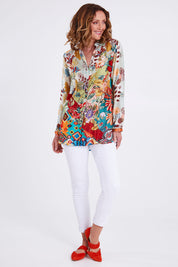 Model Emma wearing size S of the Deer Shirt in colour Multi (White), from the front, showing the whole outfit