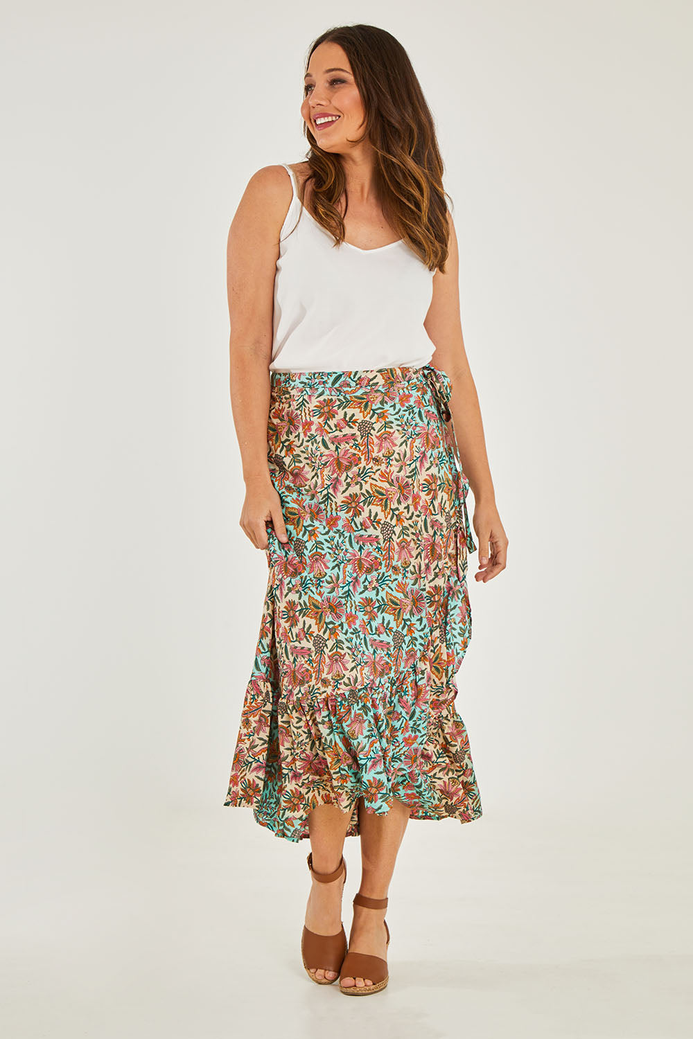 Model Georgia wearing size OneSize of the Eden Wrap Skirt in colour Eden (Blue), from the front, showing the whole outfit