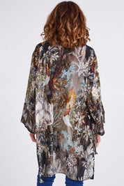 Model Emma wearing size OneSize of the Jungle Kimono in colour Jungle (Black), from the back