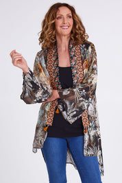 Model Emma wearing size OneSize of the Jungle Kimono in colour Jungle (Black), from the front, cropped image