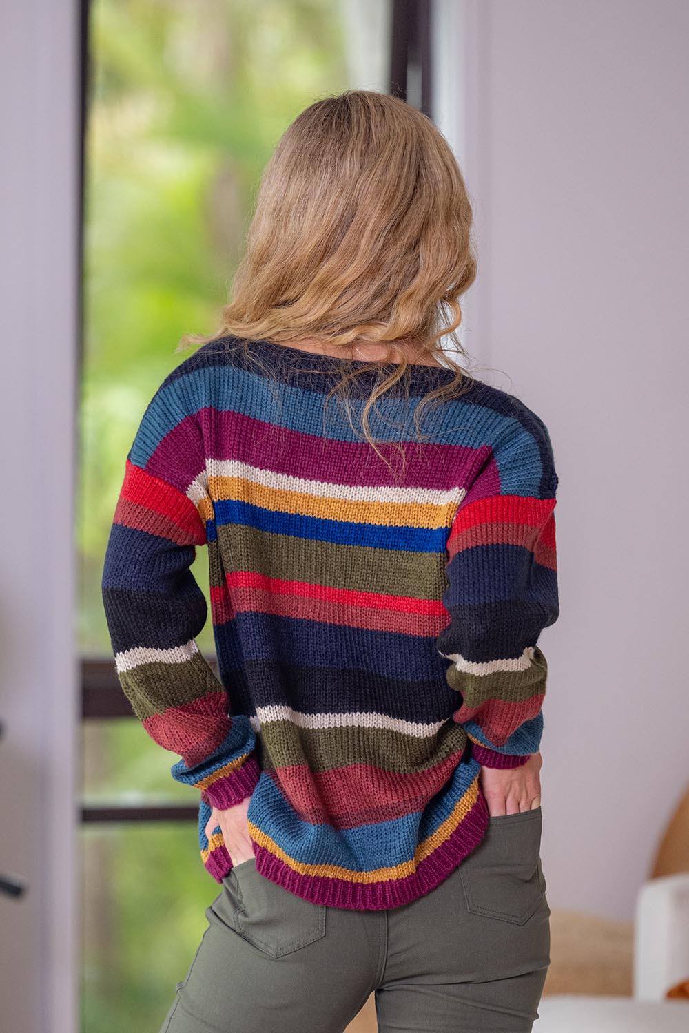 A model wearing the Stripe Sweater in colour Banff, from the back