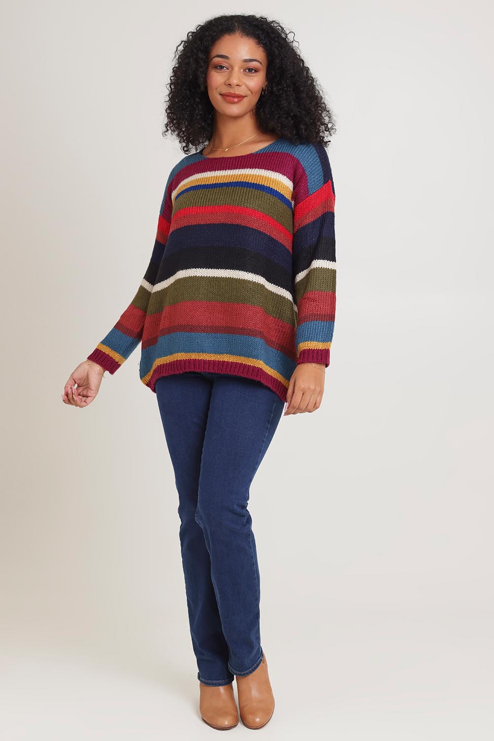 Model Ziara wearing the Stripe Sweater in colour Banff, from the front, showing the whole outfit