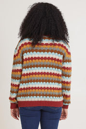Model Ziara wearing the Aspen Sweater in colour Aspen, from the back