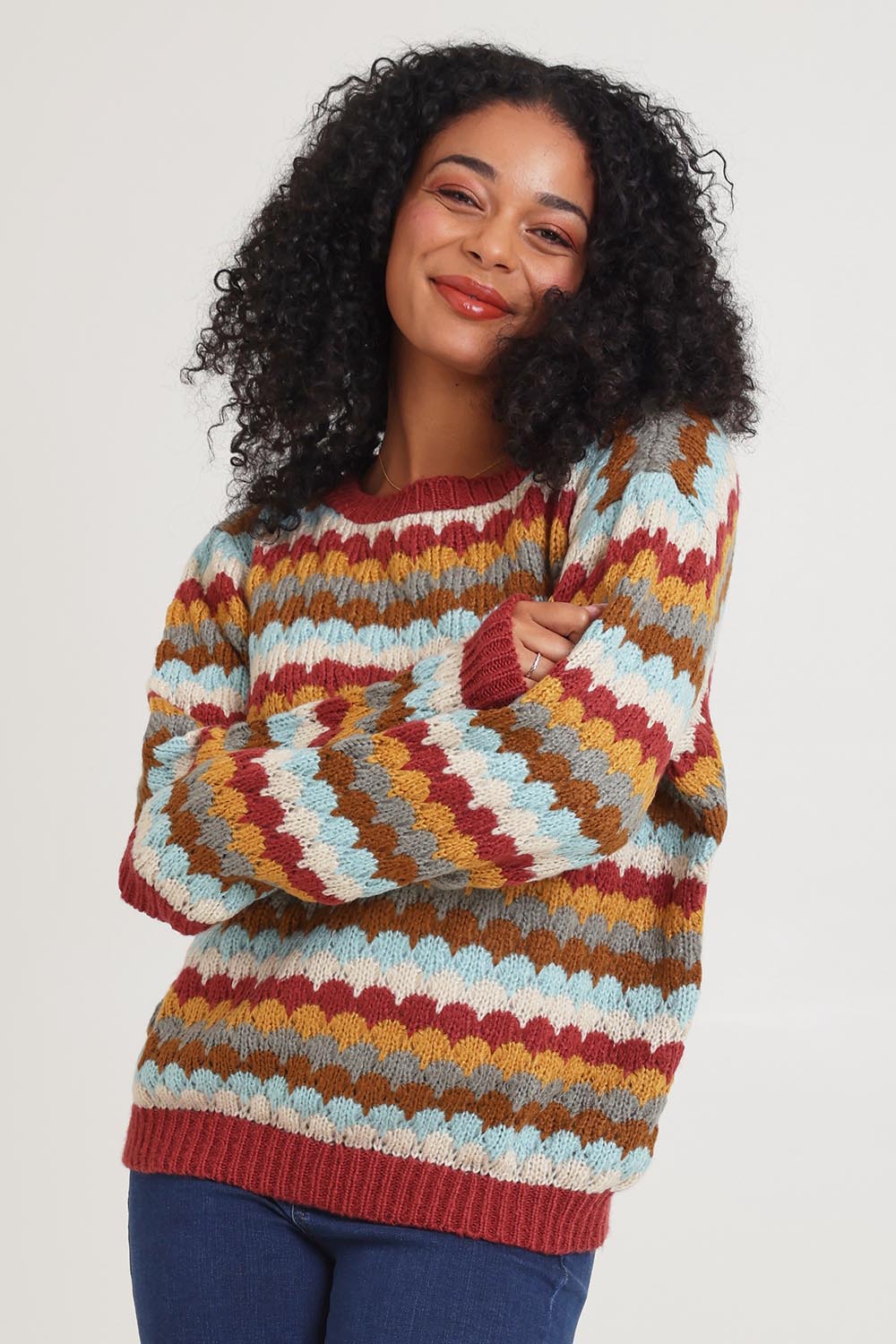 Model Ziara wearing the Aspen Sweater in colour Aspen, from the front, cropped image