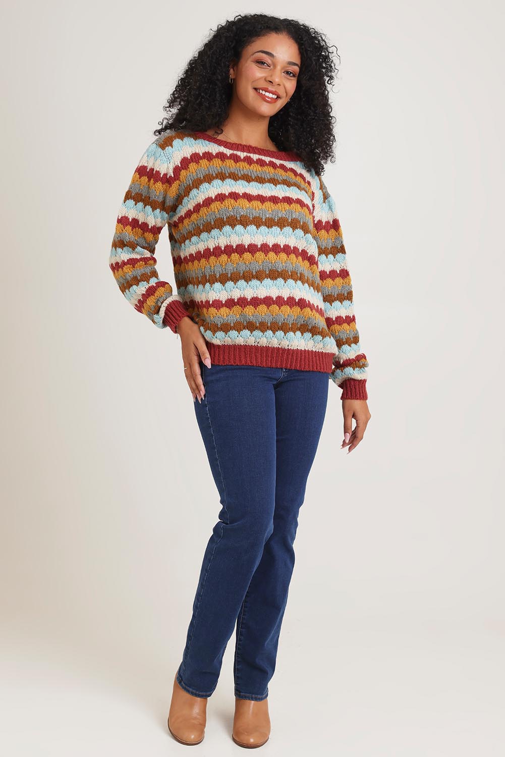 Model Ziara wearing the Aspen Sweater in colour Aspen, from the front, showing the whole outfit