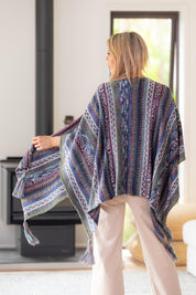 A model wearing the Lugano Wrap in colour Lugano (Blue), from the back