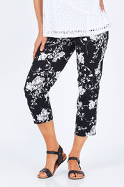 Model Gemma wearing size S of the Print Pull On Pants in colour Black (Black), from the front, cropped image