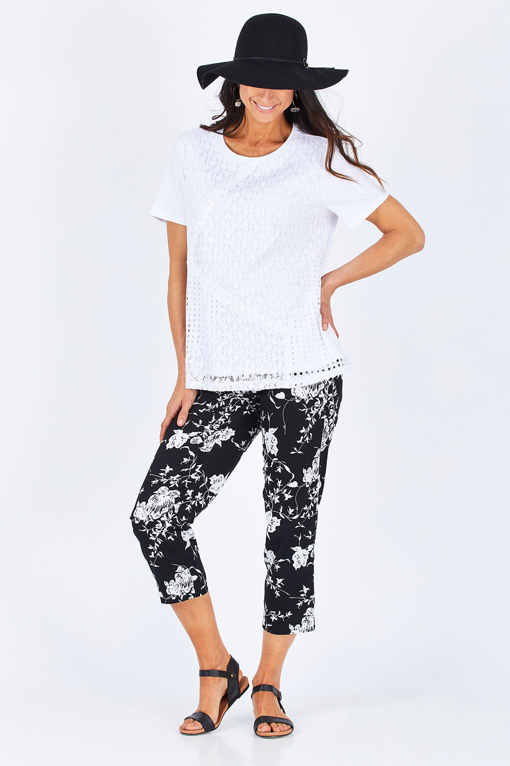 Model Gemma wearing size S of the Print Pull On Pants in colour Black (Black), from the front, showing the whole outfit