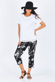 Model Gemma wearing size S of the Print Pull On Pants in colour Black (Black), from the front, showing the whole outfit