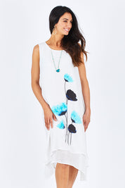 Model Gemma wearing size S of the Layered Floral Dress in colour Whiteblue (White), from the front, cropped image