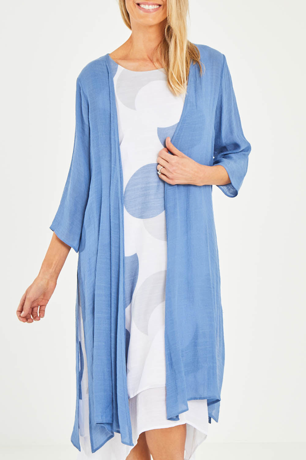 Model Kelly wearing size S of the Long Cardi in colour Denim (Blue), from the front, cropped image