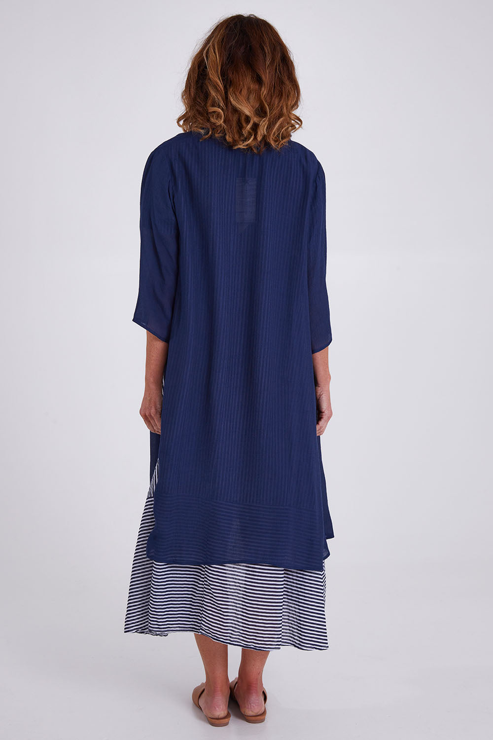 Model Emma wearing size S of the Long Cardi in colour Navy (Blue), from the back
