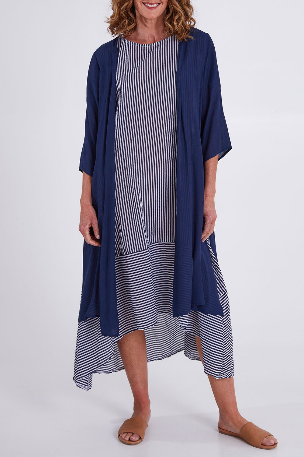 Model Emma wearing size S of the Long Cardi in colour Navy (Blue), from the front, cropped image