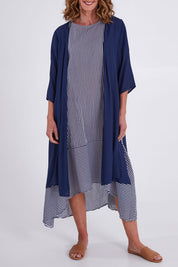 Model Emma wearing size S of the Long Cardi in colour Navy (Blue), from the front, cropped image