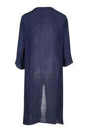 Product shot of the Long Cardi in colour Navy (Blue), from the back