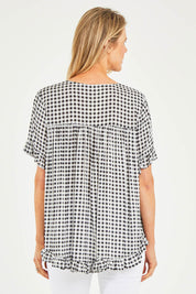 Model Kelly wearing size S of the Check Frill Hem Top in colour Black (Black), from the back