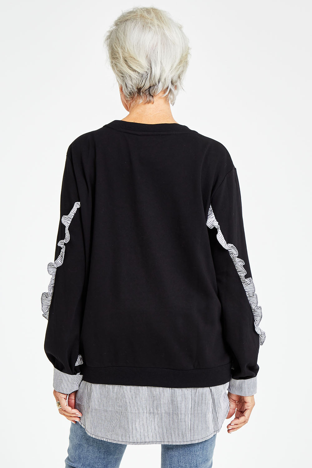 Model Elise wearing size S of the 2 In 1 Sweat in colour Black (Black), from the back