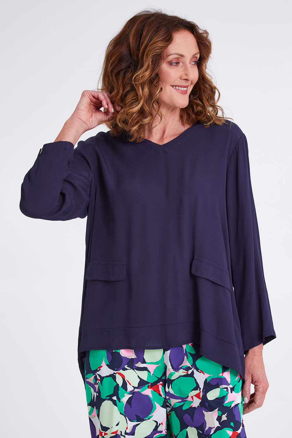 Model Emma wearing size S of the Madison Pocket Top in colour Navy (Blue), from the front, cropped image