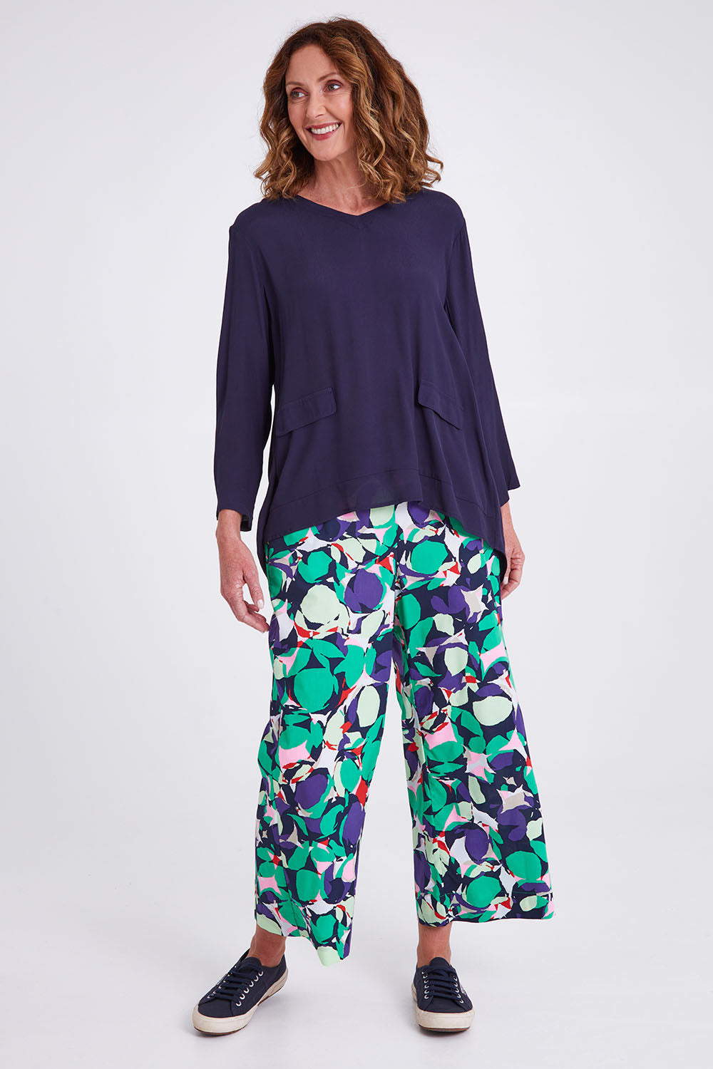 Model Emma wearing size S of the Madison Pocket Top in colour Navy (Blue), from the front, showing the whole outfit