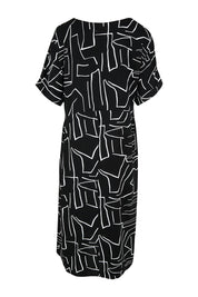 Product shot of the Empire Dress in colour Black (Black), from the back