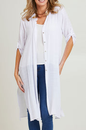Model Grace wearing size S of the Duster Shirt in colour White (White), from the front, cropped image