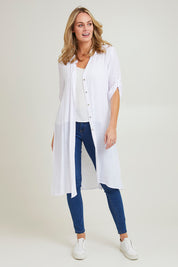 Model Grace wearing size S of the Duster Shirt in colour White (White), from the front, showing the whole outfit