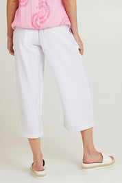 Model Grace wearing size S of the Villa Pant in colour White (White), from the back
