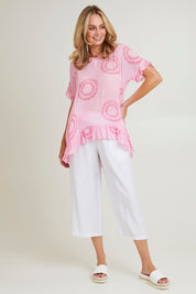 Model Grace wearing size S of the Villa Pant in colour White (White), from the front, showing the whole outfit