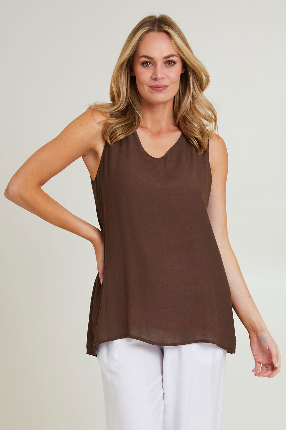 Model Grace wearing size S of the Layered Reversible Cami in colour Pinkchoc (Pink), from the front, cropped image