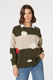 A model wearing the Moonlight Knit Jumper in colour Khaki (Green), from the front, cropped image