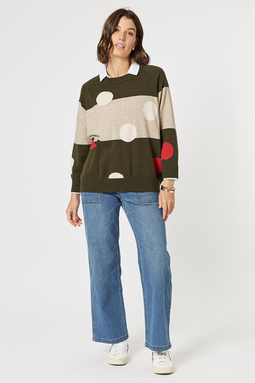 A model wearing the Moonlight Knit Jumper in colour Khaki (Green), from the front, showing the whole outfit