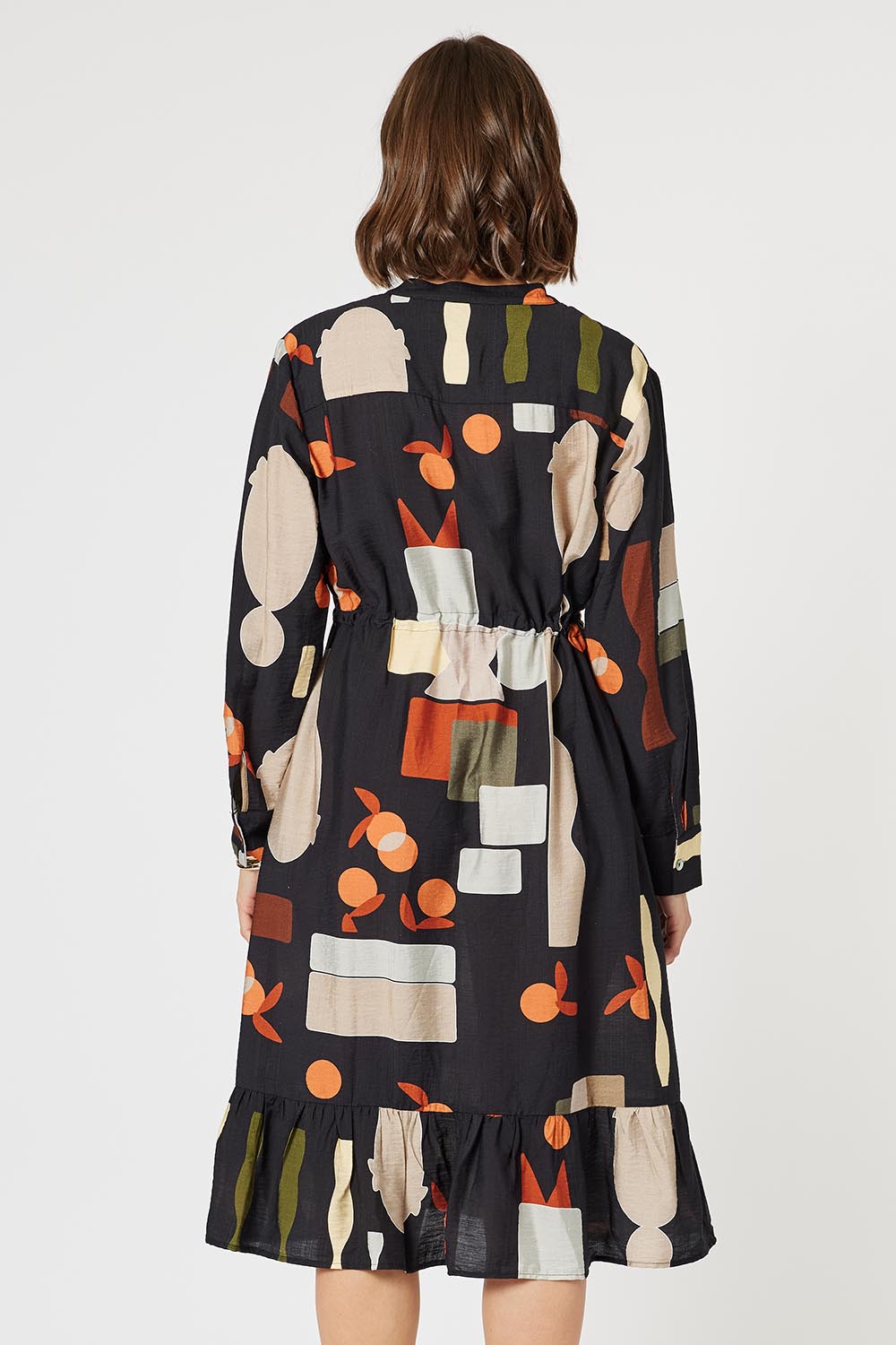 A model wearing the Galleria Dress in colour Black (Black), from the back