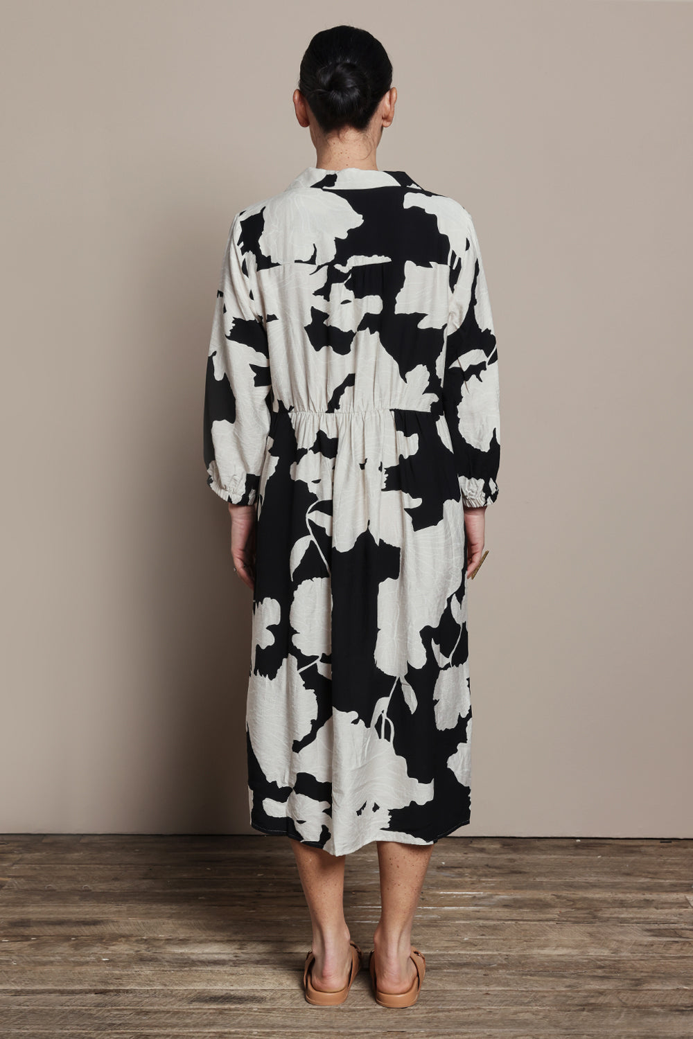 Model Katie wearing size S of the Barcelona Dress in colour Black, from the back