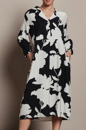 Model Katie wearing size S of the Barcelona Dress in colour Black, from the front, cropped image