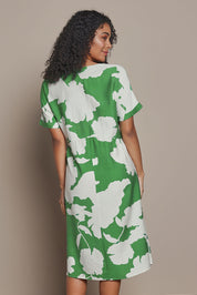 Model Ziara wearing size S of the Barcelona Dress in colour Elm (Green), from the back