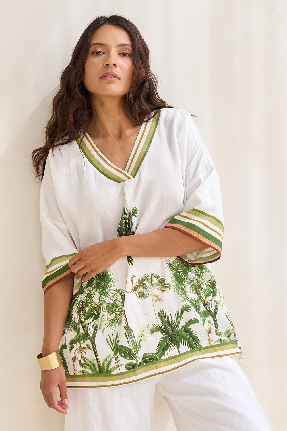 Model Tahnee wearing size S of the Amazon V Neck Top in colour Green (Green), from the front, showing the whole outfit