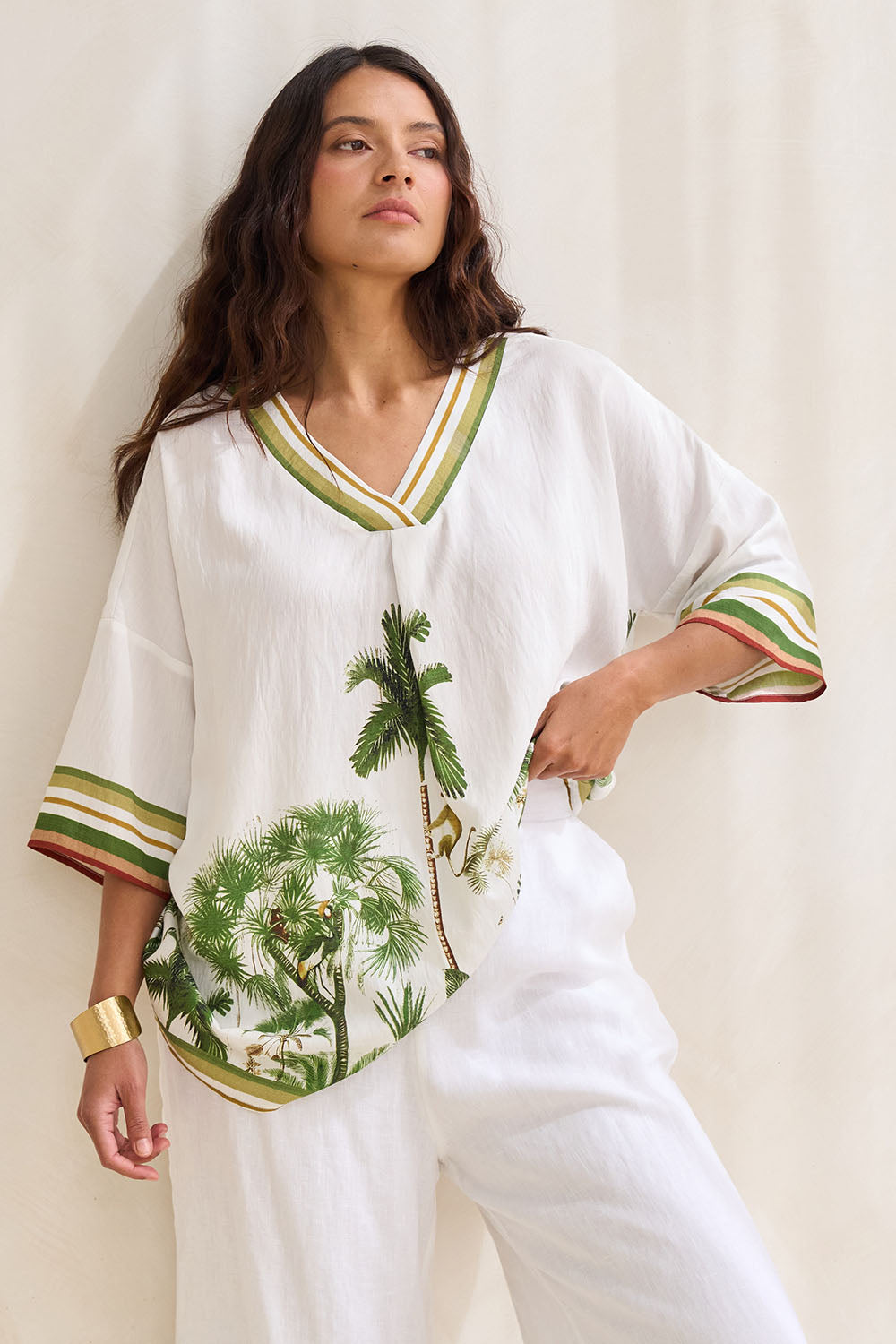 Model Tahnee wearing size S of the Amazon V Neck Top in colour Green (Green), from the front, showing the whole outfit