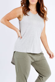 Model Laura wearing size M of the Organic Cotton Amelia Tank in colour Greymarle (Grey), from the front, cropped image