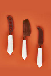 A model wearing size OneSize of the Copper Marble Cheese Knife Set Of 3 in colour Copper (Metallics), from the front, showing the whole outfit
