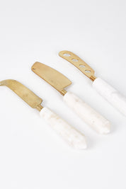 A model wearing size OneSize of the Copper Marble Cheese Knife Set Of 3 in colour Copper (Metallics), from the front, showing the whole outfit