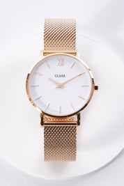 A model wearing size OneSize of the Minuit Mesh Rose Gold Watch in colour Rosegold (Metallics), from the front, showing the whole outfit