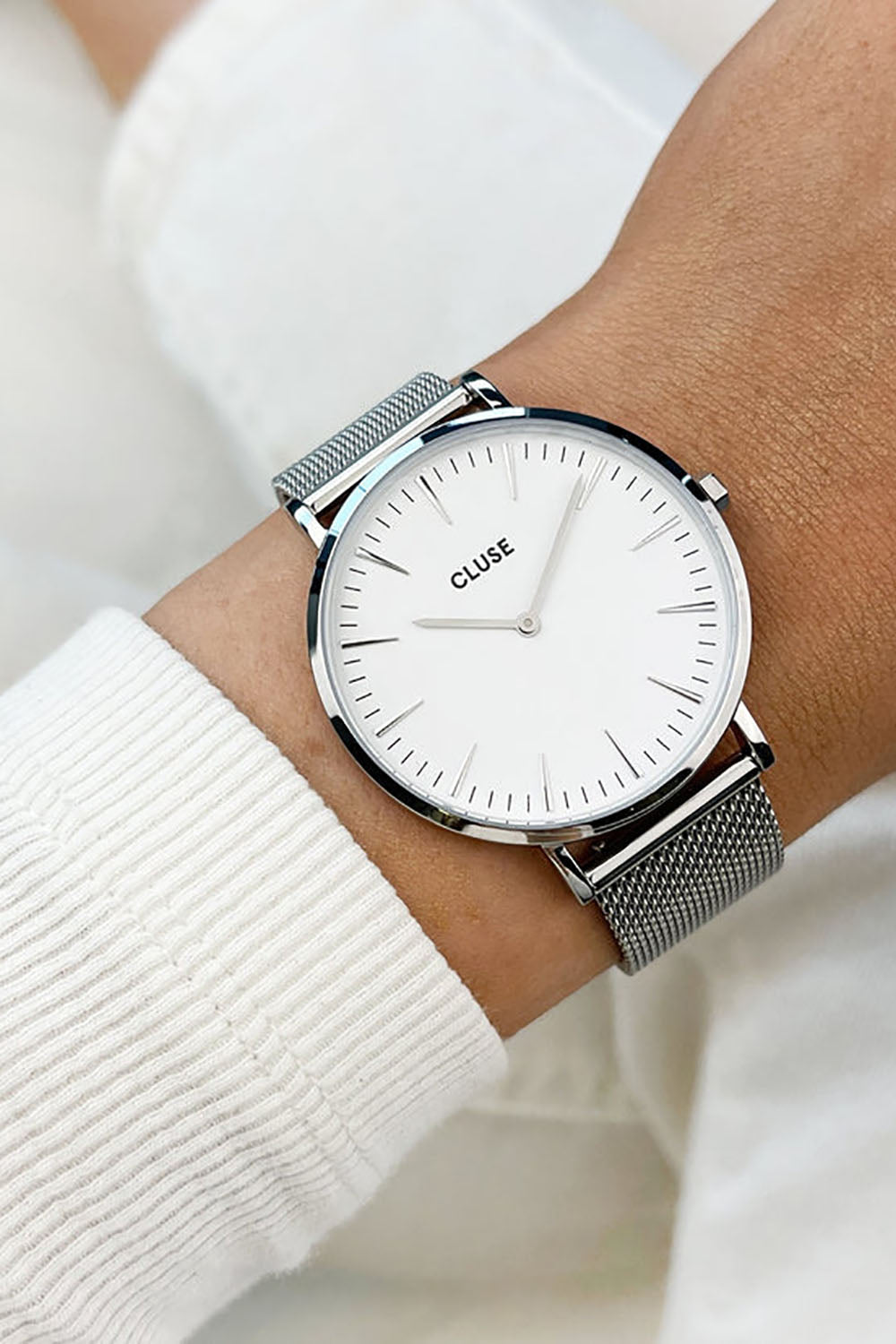 A model wearing the La Boheme Mesh Watch in colour SilverWh (Metallics), from the front, showing the whole outfit