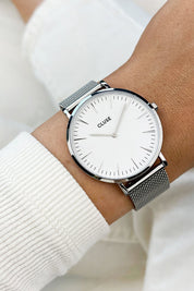 A model wearing the La Boheme Mesh Watch in colour SilverWh (Metallics), from the front, showing the whole outfit
