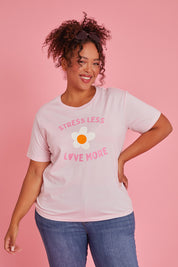Model Alexis wearing size XXL of the Stress Less Love More Tee in colour Pink (Pink), from the front, showing the whole outfit