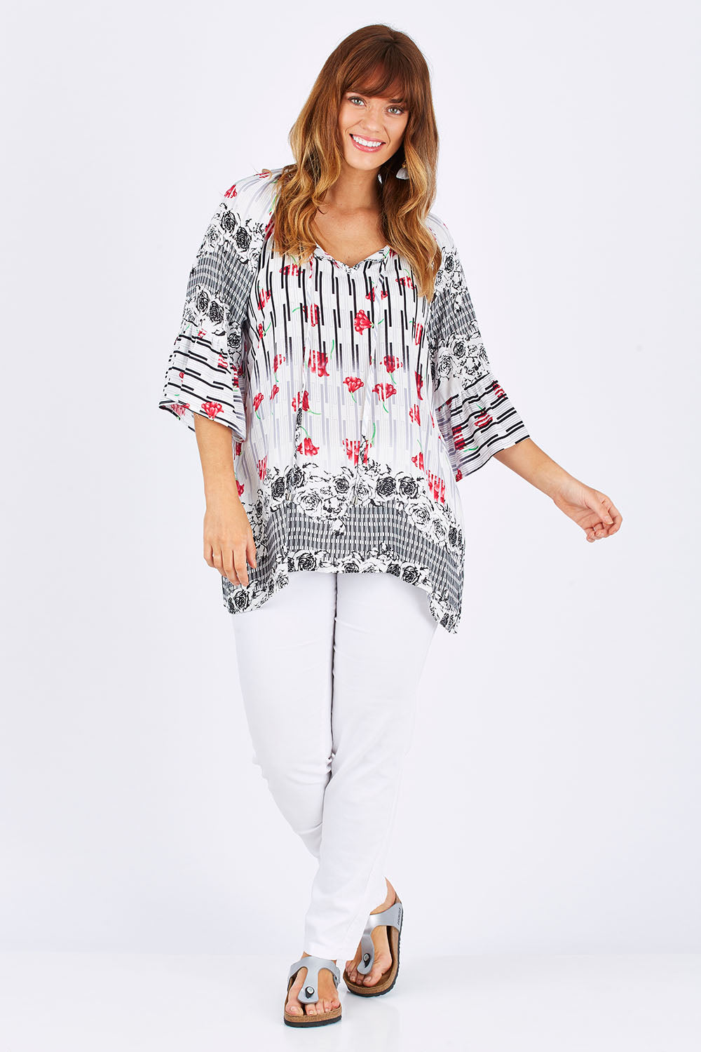 Model Laura wearing size 12 of The Summer Peasant Top in colour Ivory (White), from the front, showing the whole outfit